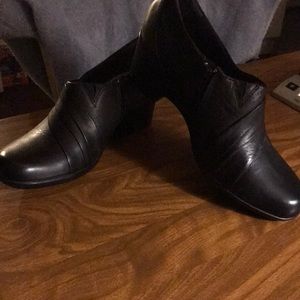 One pair of black Clark’s size 11
